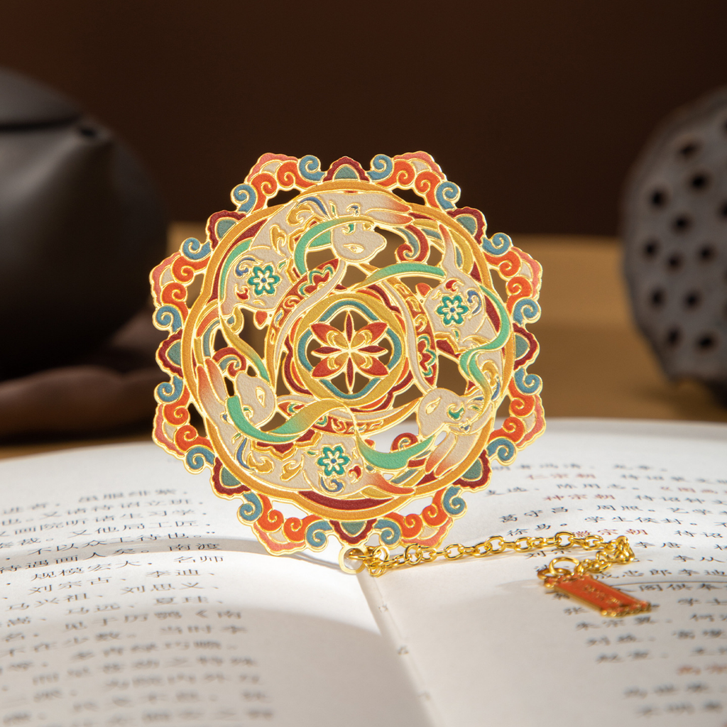 Decorative mandala bookmark on an open book with a blurred background