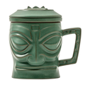 Green tiki mug with face design on a white background